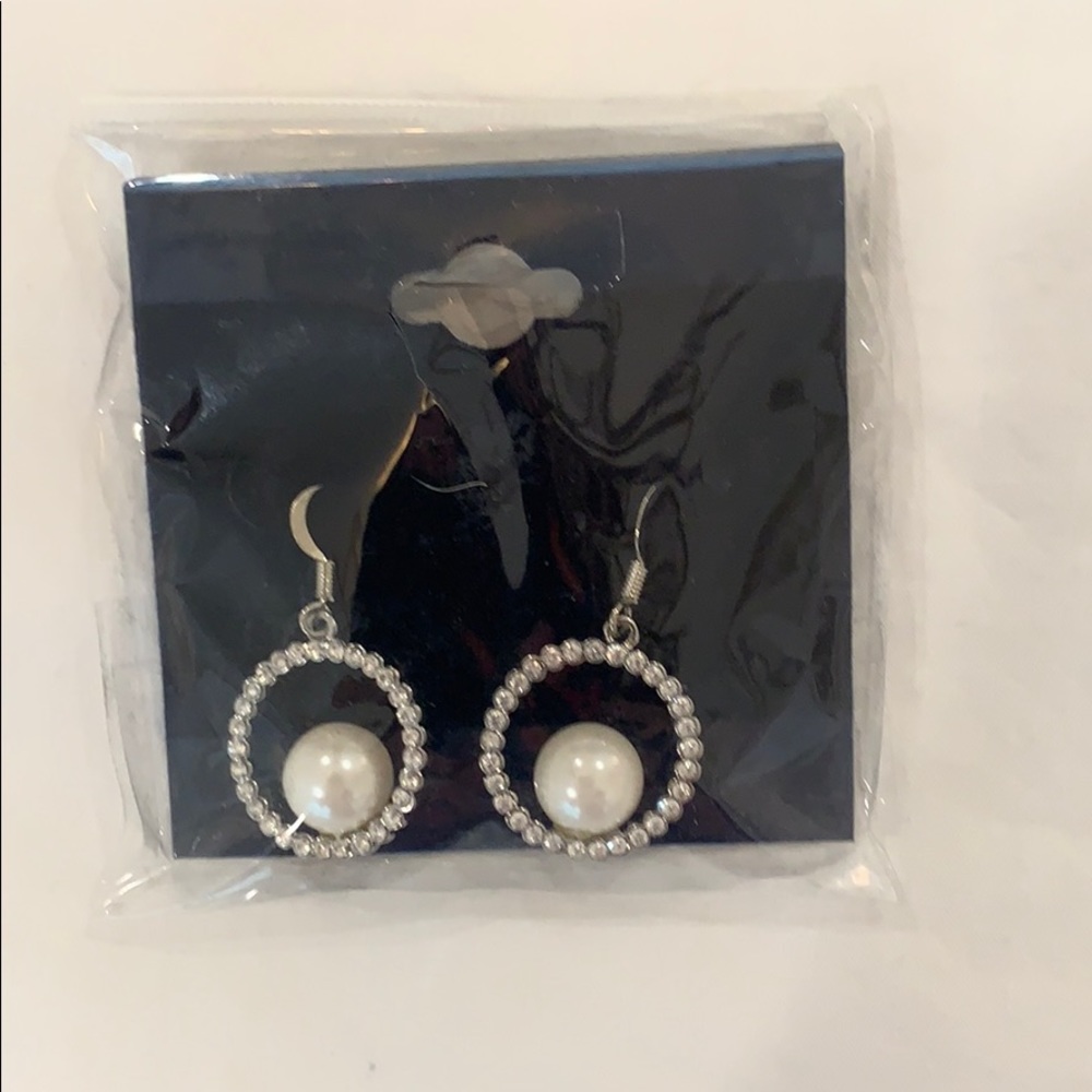 Diamond earrings with pearls inside